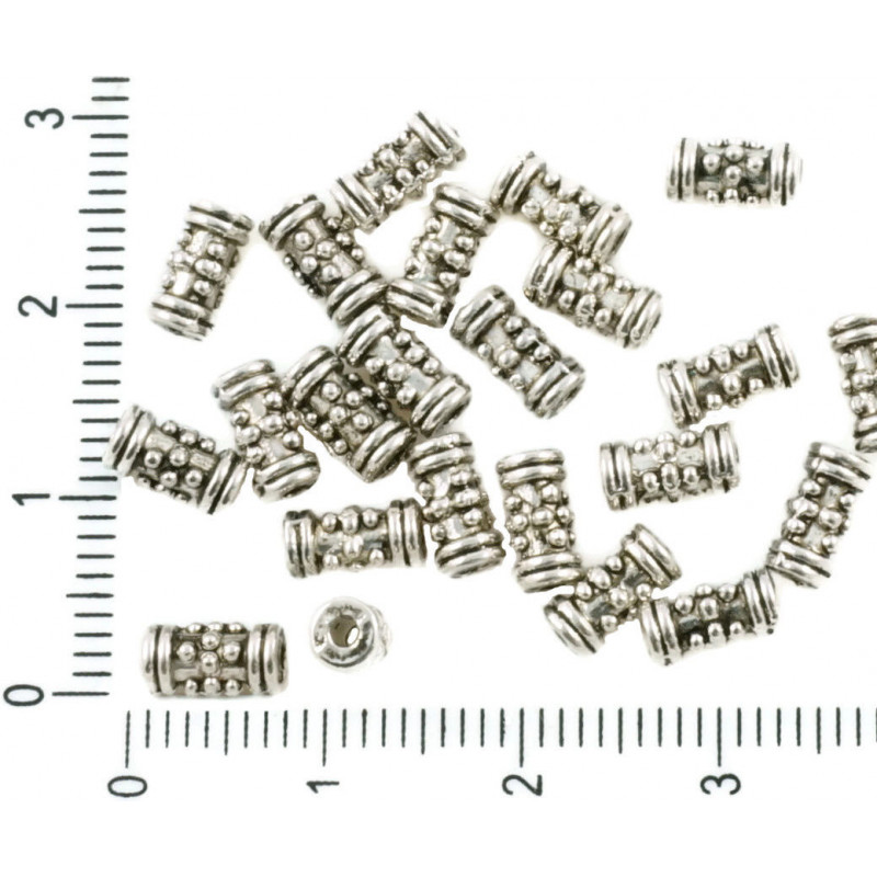 Kovové protáhlé korálky ve tvaru zdobené, starožitný stříbrný vzhled rozměry 7 mm x 4 mm 40 kusů