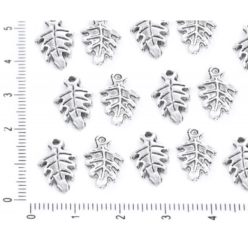 Kovový přívěsek ve tvaru listu stříbrný starožitný vzhled velikost 15 mm x 9 mm 20 kusů