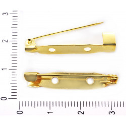 Kovové brožové můstky pozlacené, podlouhlé, se zavíracím špendlíkem se dvěma dírkami velikost můstku 30 mm x 5 mm 20 kusů